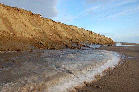 Permafrost at Arctic island summer sea coast, Chenkul Island, Chukotka Island, Russiaの写真素材