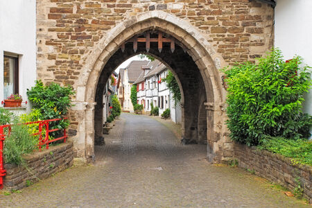 Image of a portcullis entrance into an ancient german streetの写真素材