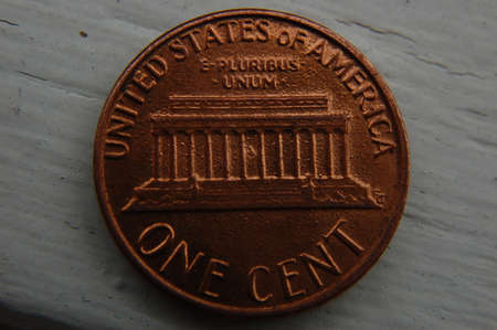 One cent coin of the United States of America on a wooden backgroundの写真素材