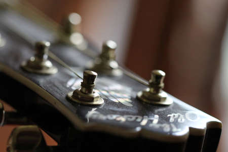 Guitar headstock close-up with shallow depth of fieldの写真素材