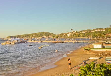 Boats and people in a tropical beach in Brazil.のeditorial素材