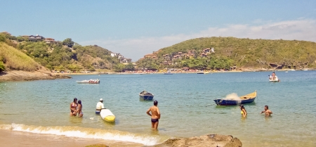Group of people at the beach in of the islands of the city of Buzios in Brazil.の写真素材