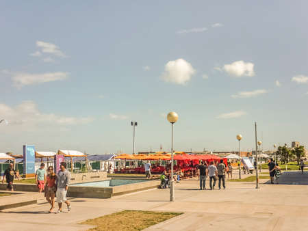 People walking in the boardwalk of Mar del Plata, the most famous seaside resort of Argentina South...