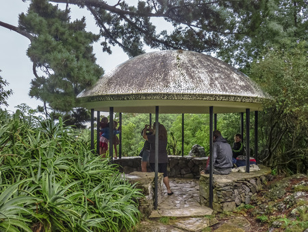 MALDONADO, URUGUAY - FEBRAURY 2014 -Familiy taking photos and enjoying nature in a stop in the Arboretum Lussich located in Uruguay near Punta del Este.のeditorial素材