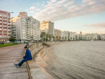 MONTEVIDEO , URUGUAY - NOVEMEBER 2014 - People enjoying the day  in the boardwalk of Montevieo , the capital city of Uruguay in South Americaのeditorial素材