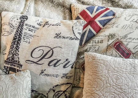Creative homemade home decor pillows detail with various design in white soft tones.の写真素材