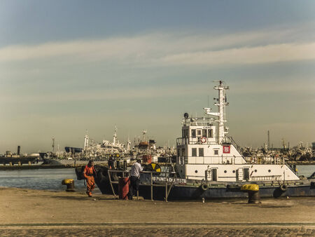 MONTEVIDEO, URUGUAY - NOVEMBER - 2014 - Little commercial boat in the river plate river in the port of Montevideo the capital city of Uruguay.のeditorial素材