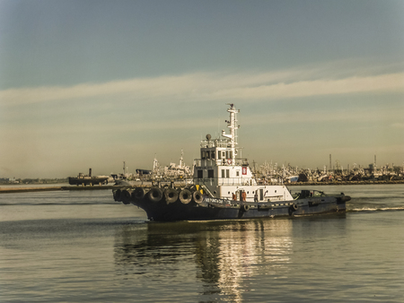 MONTEVIDEO, URUGUAY - NOVEMBER - 2014 - Little commercial boat in the river plate river in the port of Montevideo the capital city of Uruguay.のeditorial素材