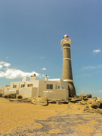 Beautiful summer day at the beach with the lighthouse as the main subject in Jose Ignacio, an exclusive watering place in Uruguayのeditorial素材
