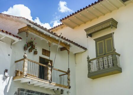 Low angle view of decorated spanish colonial style balconies in the city of Cusco in Peru, South America.の写真素材