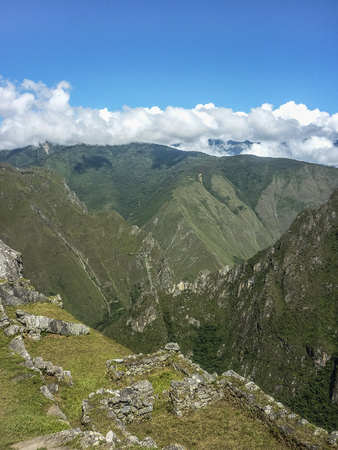 Spectacular landsacpe aerial view of big mountains and  ruins in the ancient inca city of Machu Picchu in Cuzco, Peru.の写真素材