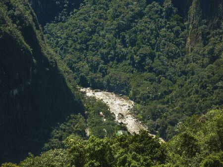 Distant view of urubamba river from the highs in the ancient inca city of Machu Picchu in Cuzco,...