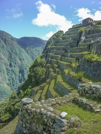 Aerial view of terraces and architecture in the highs of the most famous landmark of Cuzco in Peru, the ancient inca city of Machu Picchu.の写真素材
