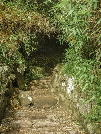 Low angle view of stone road to climb to Machu Picchu mountain in the ancient city of incas in Peru.の写真素材