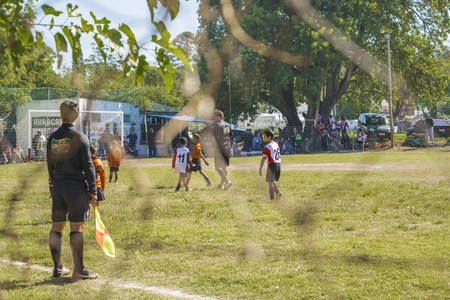 MONTEVIDEO, URUGUAY, MARCH - Spectator view photo of soccer match between two children teams in a sunny day in Montevideo, the capital of Uruguay in South America.のeditorial素材