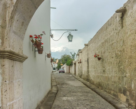 Beautiful distant view of Misti volcano from a colonial style street in the city of Arequipa in Peru, South America.の写真素材