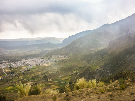 Dirt road and poor houses toward colca valley in the outsides of Arequipa city in Peru, South America.の写真素材