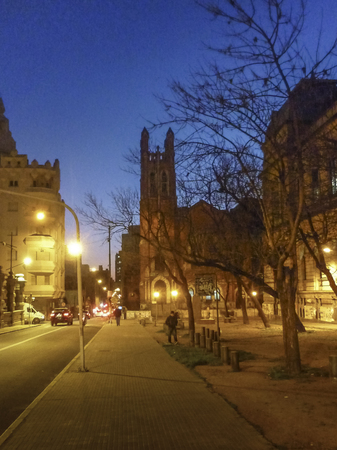 MONTEVIDEO, URUGUAY AUGUST - 2014 - Traditional street view at night in Montevideo with the law school and church buildings as the main subjects.のeditorial素材