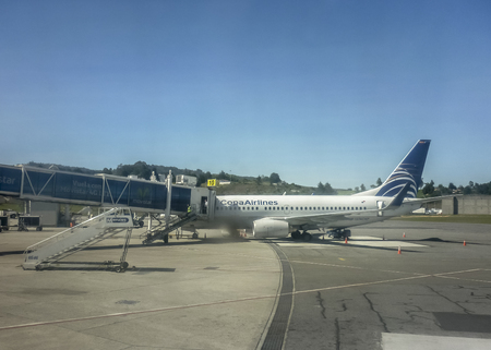 MEDELLIN, COLOMBIA, DECEMEBER - 2014 - Perspective view of plane parked at airport receiving provision in Carrasco airport in Uruguay.のeditorial素材