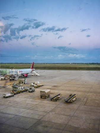 MONTEVIDEO, URUGUAY, MARCH - 2015 - Perspective view of plane parked at airport receiving provision in Carrasco airport in Uruguay.のeditorial素材