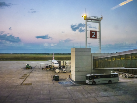 MONTEVIDEO, URUGUAY, MARCH - 2015 - Perspective view of plane parked at airport receiving provision in Carrasco airport in Uruguay.のeditorial素材