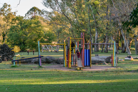 MONTEVIDEO, URUGUAY, MAY - 2015 - Children having a good time playing children games in a sunny day at park in the city of Montevideo, Uruguay.のeditorial素材