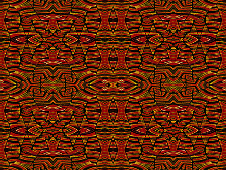Intricate geometric tribal style abstract seamless pattern in vivid and saturated red and orange colors.の写真素材