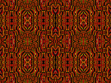 Intricate geometric tribal style abstract seamless pattern in vivid and saturated red and orange colors.の写真素材