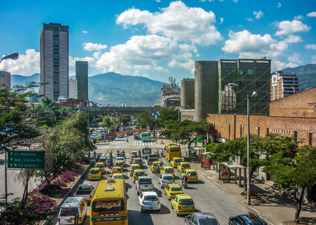 MEDELLIN, COLOMBIA, DECEMBER - 2014 - Aerial view of modern business buildings and highway with andes range mountains at background in Medellin, one of the most important cities of Colombia.のeditorial素材