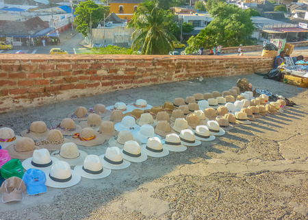 CARTAGENA, COLOMBIA, JANUARY - 2015 - Perspective view of traditional tropical hats for sale at the entrance of San Felipe de Barajas Fortress, an spanish colonial style defense building located in Cartagena, Colombiaのeditorial素材