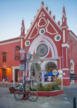 CARTAGENA, COLOMBIA, JANUARY - 2015 - Picturesque red church at square in Cartagena, the most famous seaside resort of Colombia.のeditorial素材