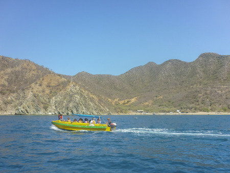 Touristic boat heading to paradise island in caribbean sea at El Rodadero, one of the most famous and visited watering places of Colombia.のeditorial素材