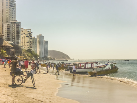 SANTA MARTA, COLOMBIA, JANUARY - 2015 - Sunny day at crowded beach at El Rodadero, one of the most famous and visited watering places of Colombia.のeditorial素材