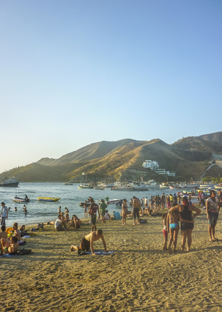 TAGANGA, COLOMBIA, JANUARY - 2015 - People enjoying a sunny day at the beach at caribbean bay called Taganga, one of the most important watering places in Colombiaのeditorial素材