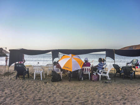 SANTA MARTA, COLOMBIA, JANUARY - 2015 - People enjoying a sunnny day at Bahia Concha beach, one of the beaches of Tayrona National Park in Colombia.のeditorial素材