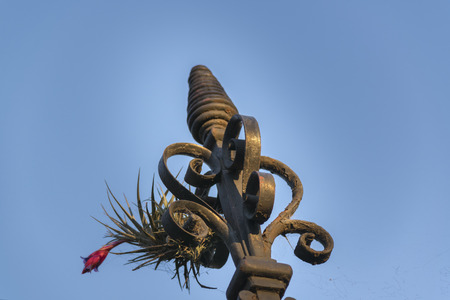 Low angle close up view of grid iron ornament against clean blue skyの写真素材
