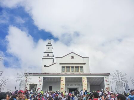 BOGOTA, COLOMBIA, JANUARY - 2015 - Low angle view of  Monserrate Basilica with lots of people surrounded at Monserrate Hill in Bogota, Colombiaのeditorial素材