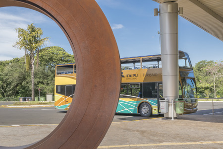 FOZ DO IGUACU, BRAZIL, APRIL - 2015 - Bus parked which is used for taking people to a touristic journey to know the famous Itaipu dam located in the borders of Brazil and Paraguay in South America.のeditorial素材
