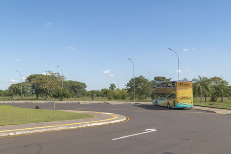 FOZ DO IGUACU, BRAZIL, APRIL - 2015 - Bus parked which is used for taking people to a touristic journey to know the famous Itaipu dam located in the borders of Brazil and Paraguay in South America.のeditorial素材