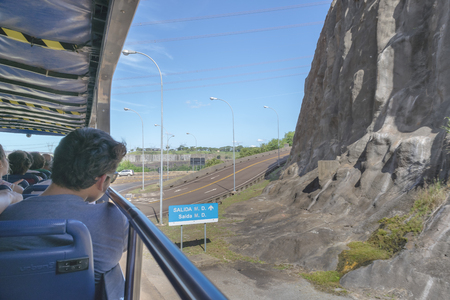 FOZ DO IGUAZU, BRAZIL, APRIL - 2015 - People at a bus trip to Itaipu dam installations at the brazilian borderのeditorial素材