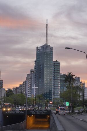 MONTEVIDEO, URUGUAY, JULY - 2015 - Sunset urban scene with modern buildings and street in the city of Montevideo, the capital of Uruguay.のeditorial素材