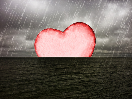 Digital technique photo collage love or emotional conceptual composition of a heart drowning in empty sea at rainy night.の写真素材