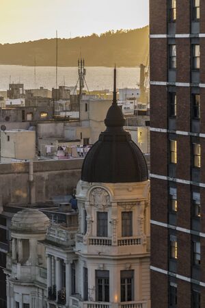 Aerial view at sunset time of bay and the most high hill in the city of Montevideo, the capital of...