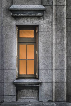 Vertical format photo detail of window and concrete wall of the most famous eclectic art deco style building of Uruguay, the Palacio Salvo which is located in his capital Montevideoの写真素材