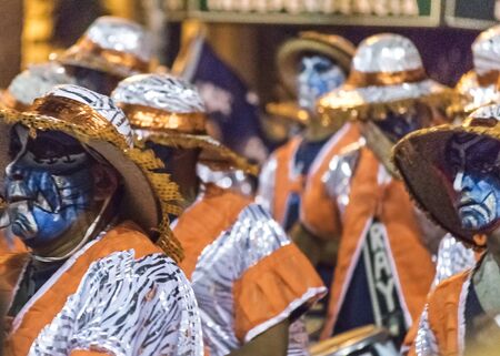 MONTEVIDEO, URUGUAY, JANUARY - 2016 - Costumed men drummers playing traditional music called...