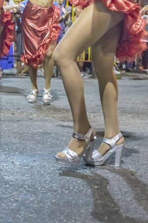 MONTEVIDEO, URUGUAY, JANUARY - 2016 - Bottom view shot of women dancers legs at inaugural parade of carnival of Montevideo, Uruguayのeditorial素材