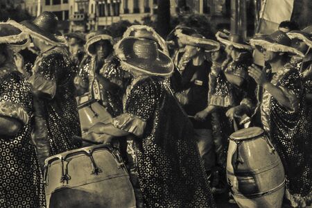 MONTEVIDEO, URUGUAY, JANUARY - 2016 - Costumed men drummers playing traditional music called...