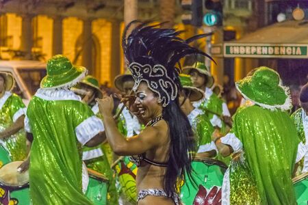 MONTEVIDEO, URUGUAY, JANUARY - 2016 - Attractive costumed young black woman dancing and candombe...