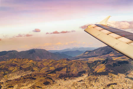 Aerial view from window plane with big mountains and sky as the main subject.の写真素材