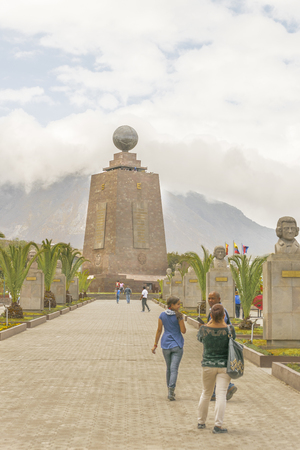 QUITO, ECUADOR, OCTOBER - 2015 - Group of tourists visiting the most visited touristic location in Ecuador, the middle earth monument.のeditorial素材